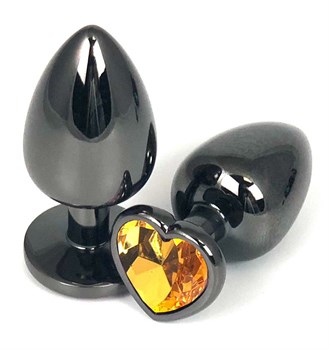 Черная металлическая анальная пробка с оранжевым стразом-сердечком - 6,5 см.