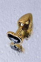 Золотистая коническая анальная пробка с черным кристаллом-сердечком - 7 см.  - фото 1294933