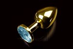 Маленькая золотистая анальная пробка с круглым кончиком и голубым кристаллом - 7 см. - фото 144771