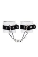 Бело-черные кожаные наручники с одним ремешком с люверсами 523588 Бело-черные кожаные наручники с одним ремешком с люверсами 523588